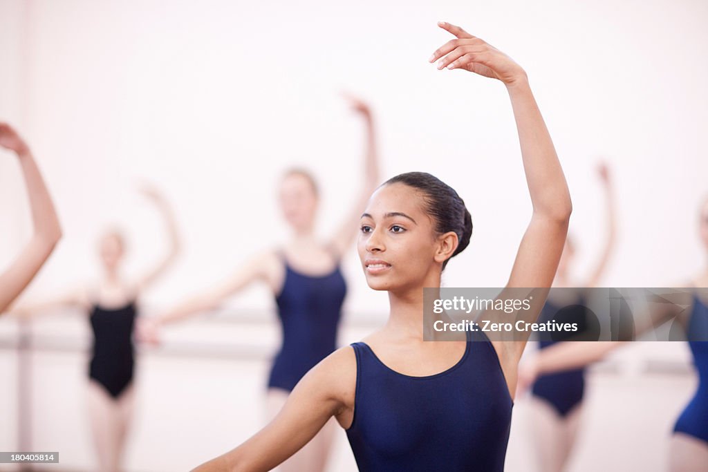 Group of synchronized teenage ballerinas