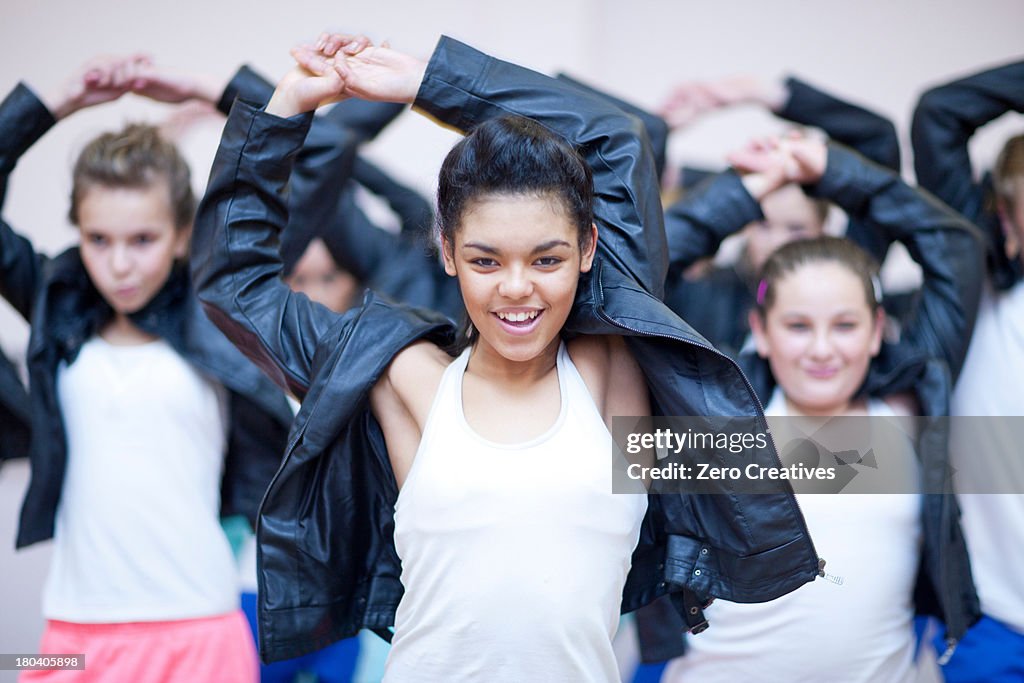 Group of teenagers dancing hip hop in studio