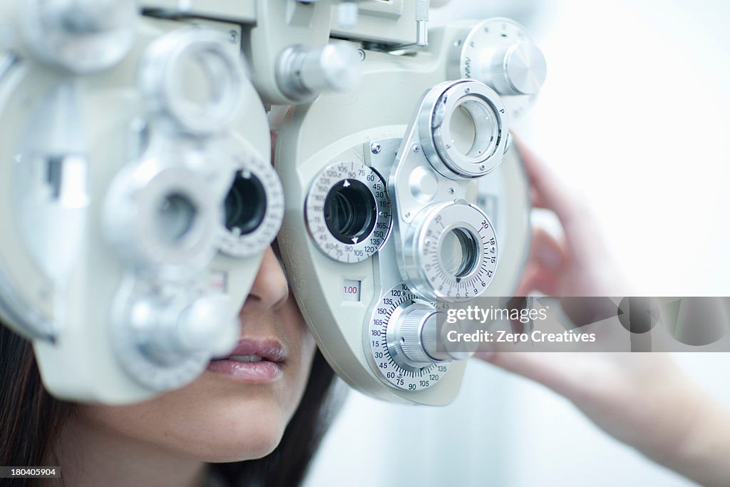 Young woman having eye test