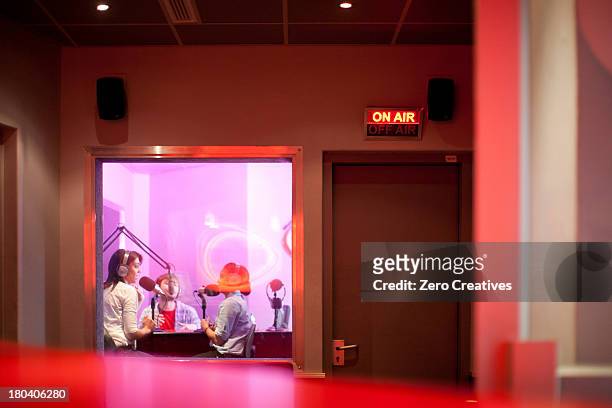 women and man broadcasting in recording studio - radio dj stockfoto's en -beelden