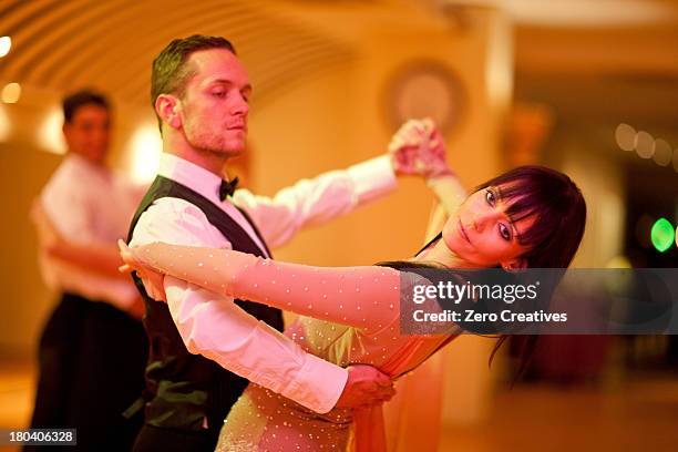 young ballroom dancers in studio - ballroom fotografías e imágenes de stock