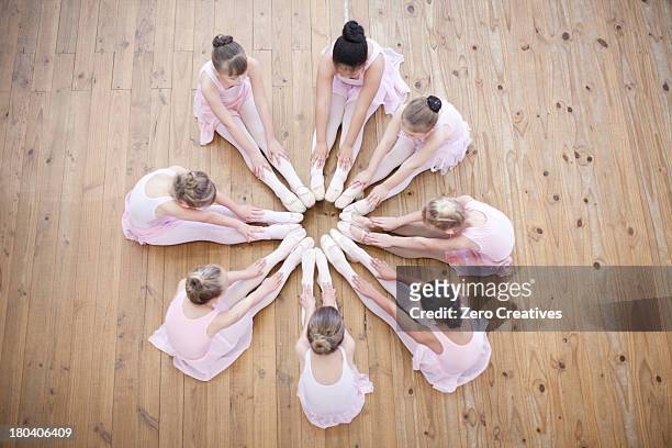 elevated view of young ballerina group in circle - children circle floor stock pictures, royalty-free photos & images