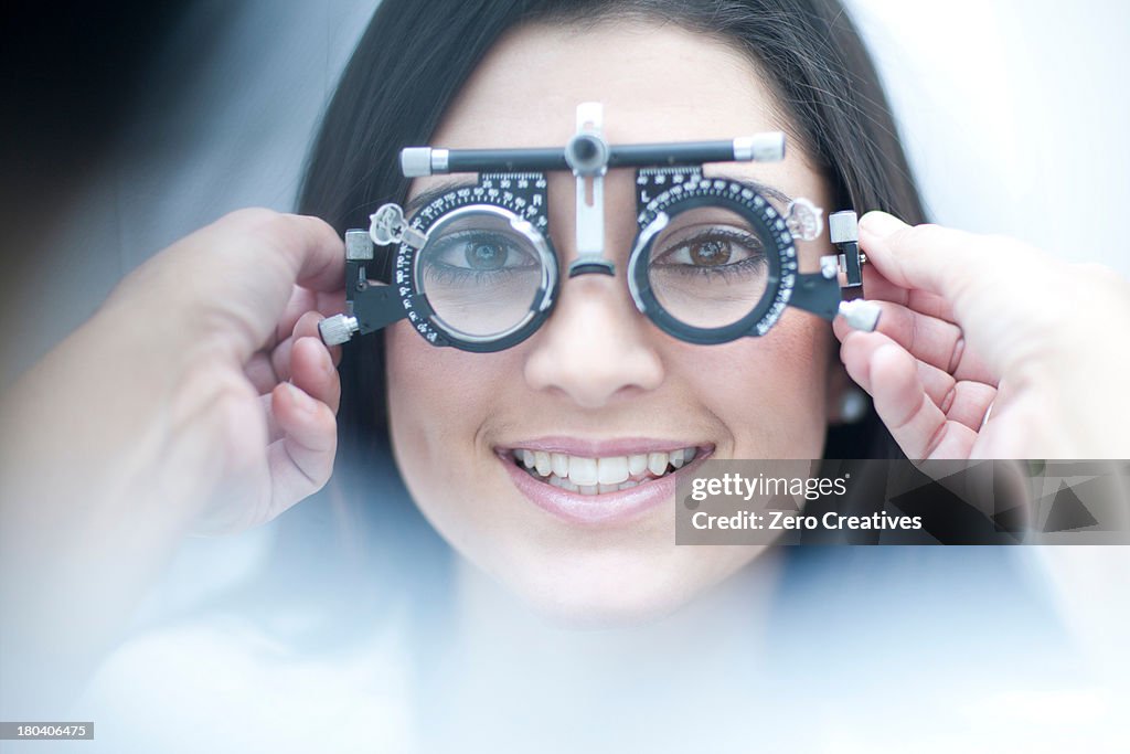 Young female having her eyes examined