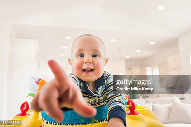usa, utah, lehi, portrait of baby (18-23 months) pointing - baby pointing stockfoto's en -beelden