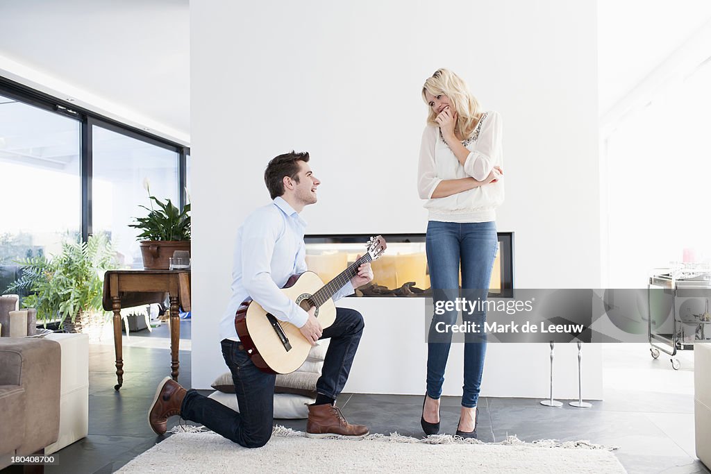 The Netherlands, Man playing guitar in front of woman