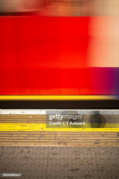 london underground train leaving station - underground station platform stock pictures, royalty-free photos & images