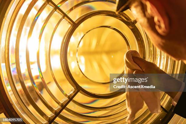lighthouse keeper cleans glass - lighthouse keepers house stock pictures, royalty-free photos & images