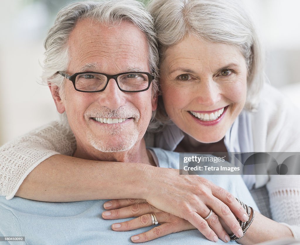 USA, New Jersey, Jersey City, Senior woman embracing senior man
