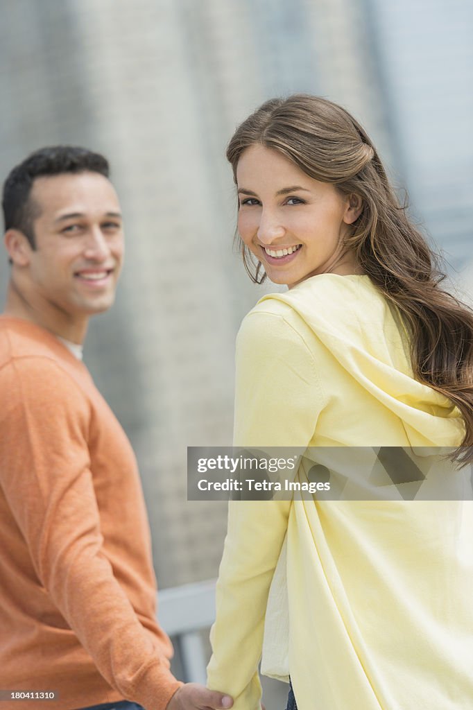 USA, New Jersey, Jersey City, Happy young couple on walk