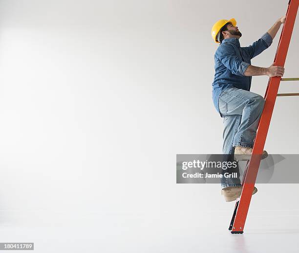 Person Using A Ladder 8,053 People Climbing Ladder Stock Photos, High-Res Pictures, and ...