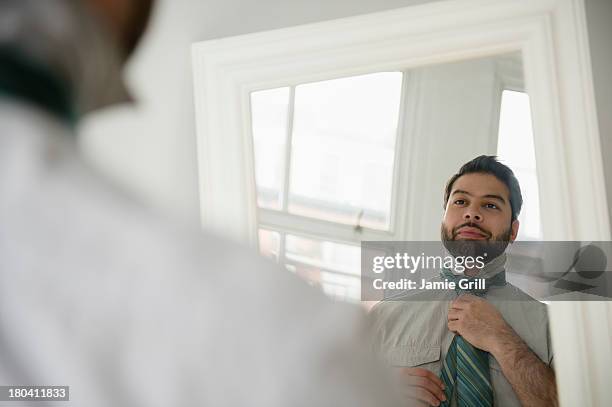 usa, new jersey, jersey city, reflection of man tying tie - tie bildbanksfoton och bilder