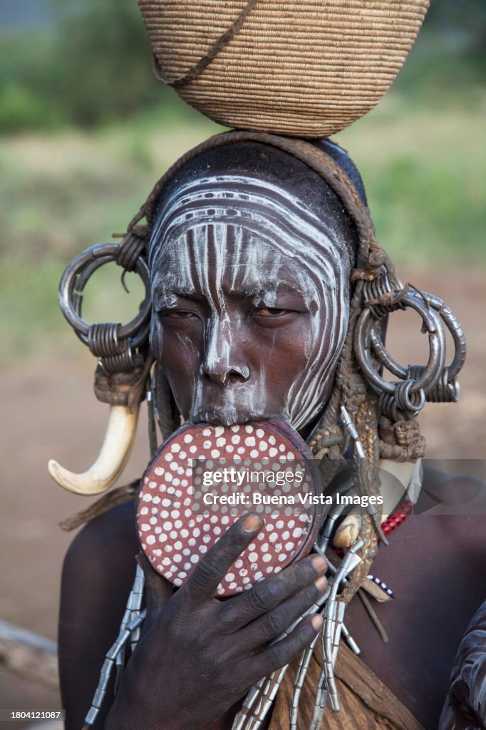 African woman with clay lip plate