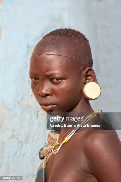 african woman with clay  plate in her ears - clay earring stock pictures, royalty-free photos & images