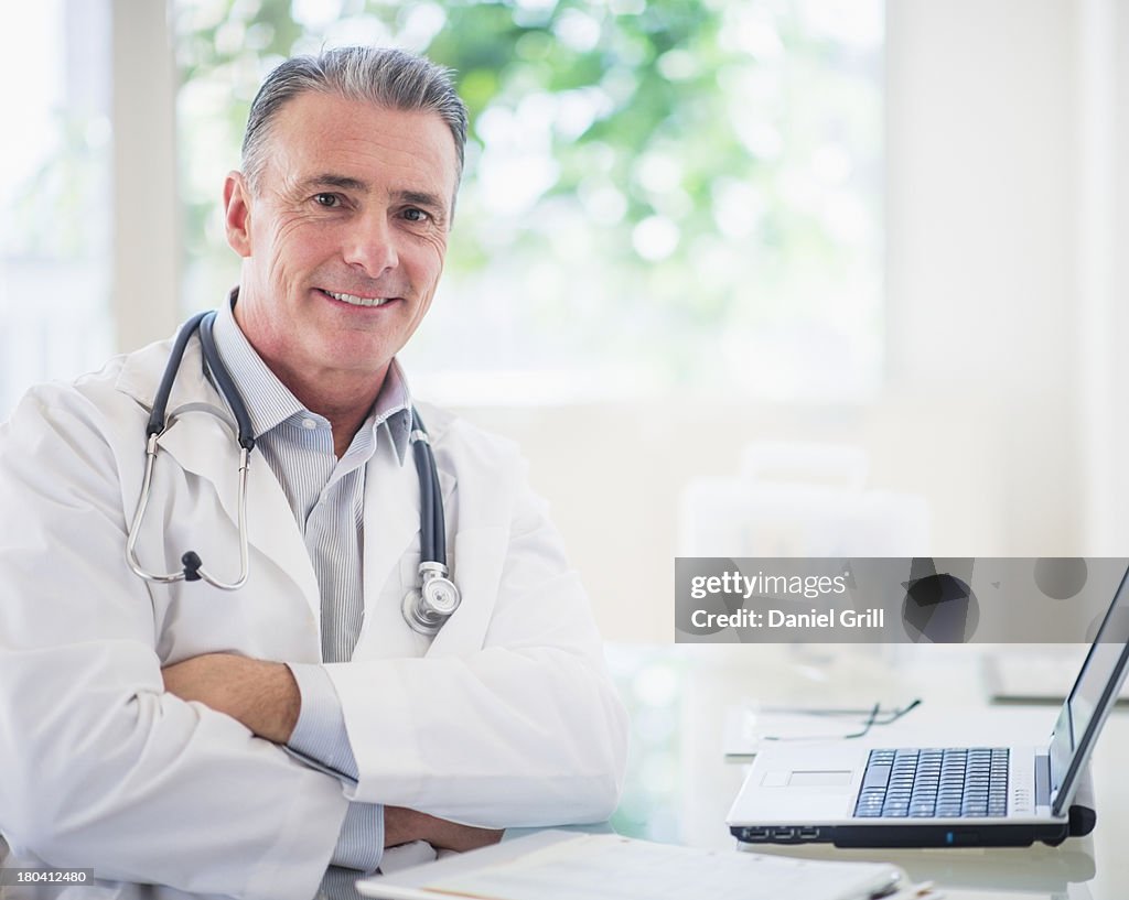 USA, New Jersey, Jersey City, Portrait of doctor in his office