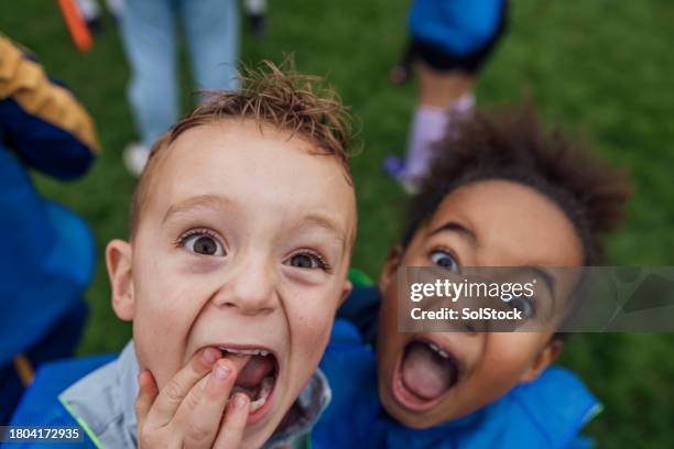 fun and energy at football training - kids soccer funny stock pictures, royalty-free photos & images