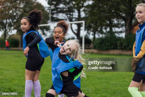 girls football practice is fun - in sport stock pictures, royalty-free photos & images