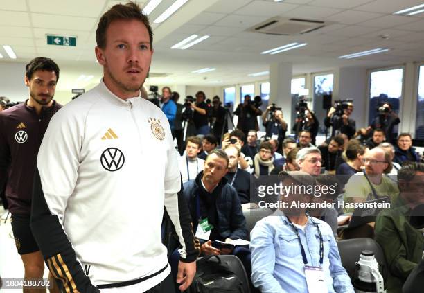 Mats Hummels of Germany arrives with his head coach Julian Nagelsmann for a DFB Press Conference at Ernst Happel Stadion on November 20, 2023 in...