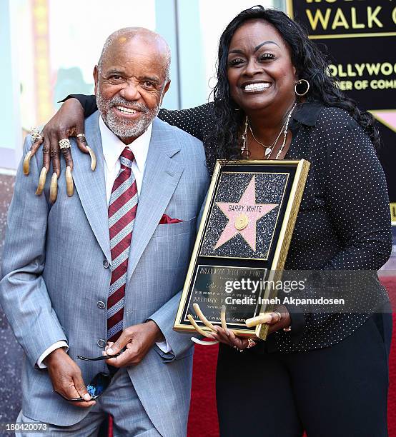 Music producer/songwriter Berry Gordy and singer Glodean White pose for a photo as the late Barry White was honored posthumously with a star on the...