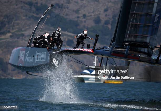 Emirates Team New Zealand skippered by Dean Barker in action against Oracle Team USA skippered by James Spithill during race six of the America's Cup...