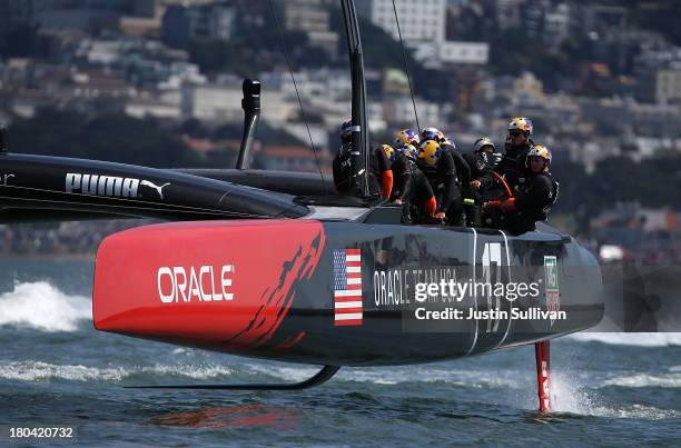 Oracle Team USA skippered by James Spithill in action against Emirates Team New Zealand skippered by Dean Barker during race six of the America's Cup...