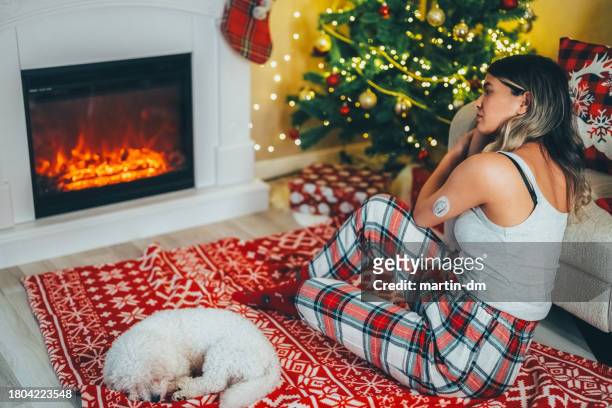 depressed woman at home during christmas - worried pet owner stock pictures, royalty-free photos & images