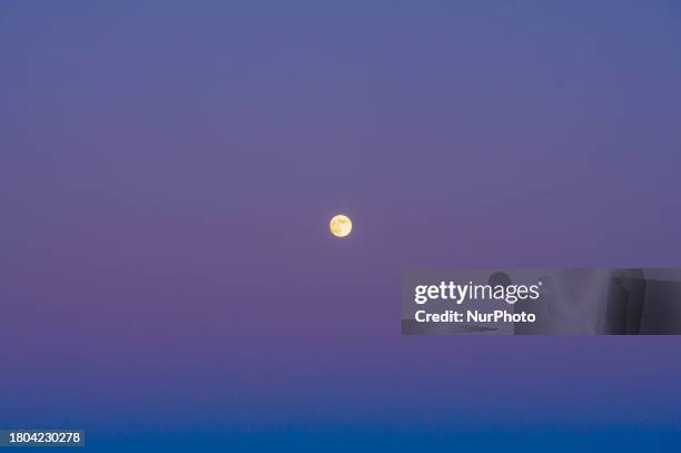 Beaver full moon at sunrise is seen from L'Aquila, Italy, on November 26th, 2023. November Full Moon is known among Native Americans as the 'Beaver...