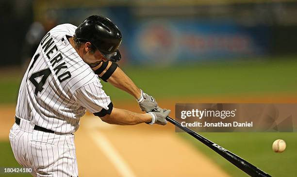 Paul Konerko of the Chicago White Sox hits a solo home run in the 2nd inning against the Cleveland Indians at U.S. Cellular Field on September 12,...