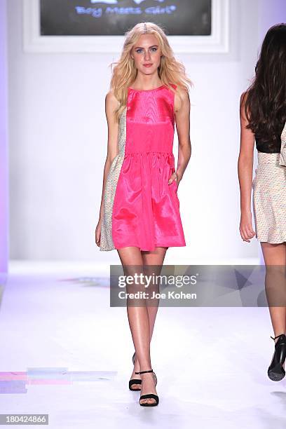 Model walks the runway at the Just Dance with Boy Meets girl by Stacy Igel fashion show during Style360 Spring 2014 at Metropolitan Pavilion on...