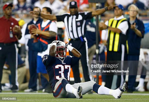 Cornerback Alfonzo Dennard of the New England Patriots reacts after missing an interception in the second quarter against the New York Jets at...
