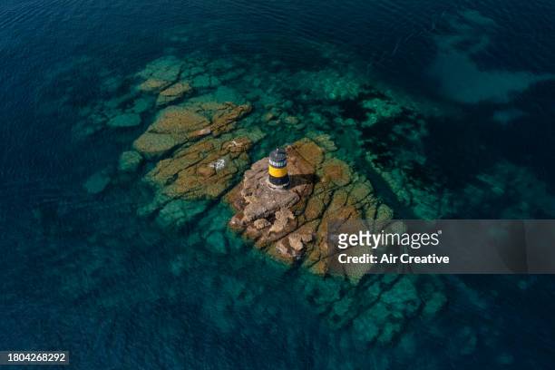 drone image of a cardinal beacon on a rocky reef, var, france - bandol photos et images de collection