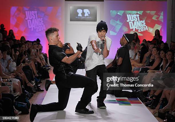 Recording artist Austin Mahone performs on the runway during Just Dance with Boy Meets Girl show at the STYLE360 Fashion Pavilion in Chelsea on...