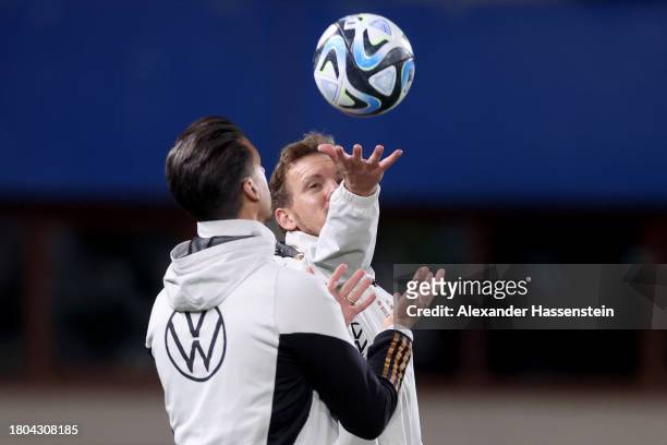 Julian Nagelsmann, head coach of Germany reacts with his assistent coach Sandro Wagner during a DFB Training Session at Ernst Happel Stadion on...