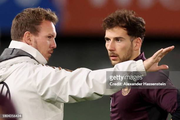 Julian Nagelsmann, head coach of Germany talks to his player Leon Goretzka during a DFB Training Session at Ernst Happel Stadion on November 20, 2023...