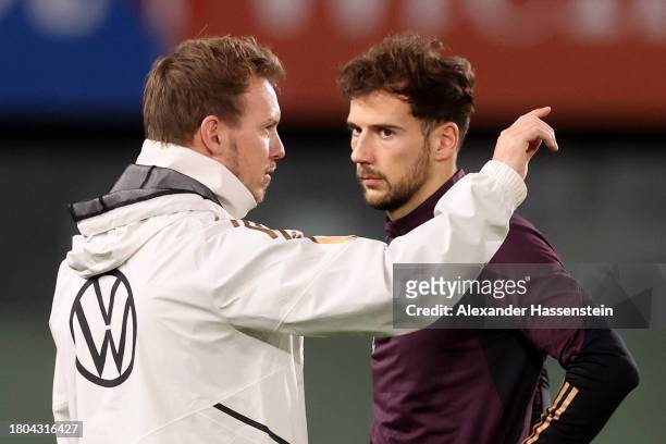 Julian Nagelsmann, head coach of Germany talks to his player Leon Goretzka during a DFB Training Session at Ernst Happel Stadion on November 20, 2023...