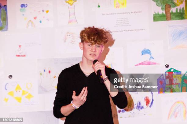 Liam Osterhold performs during the opening of the first "Childhood House" on November 20, 2023 in Hessen, Germany.