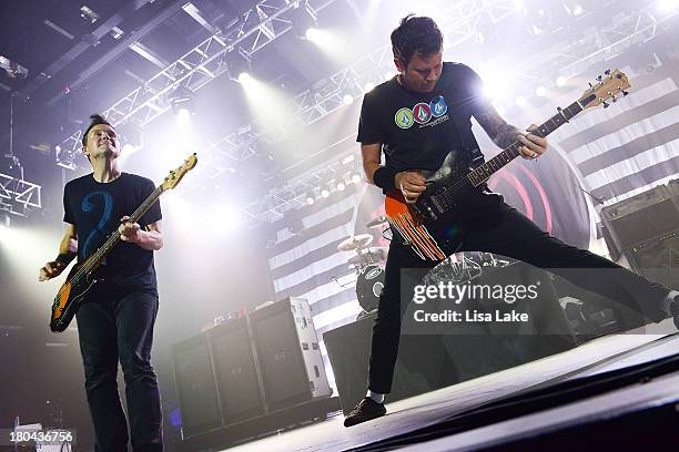 Bassist Mark Hoppus and guitarist Tom DeLonge of Blink 182 perform in concert at Sands Bethlehem Event Center on September 12, 2013 in Bethlehem,...