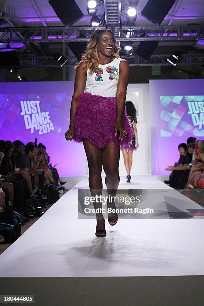 Tennis player Sloane Stephens walks the runway during Just Dance with Boy Meets Girl at Fashion Pavilion in Chelsea on September 12, 2013 in New York...