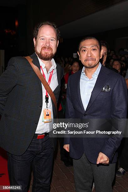Programmer Collin Geddes and Director Hitoshi Matsumoto arrive at the "R100" premiere during the 2013 Toronto International Film Festival at Ryerson...