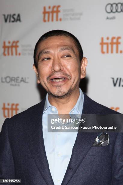 Director and actor Hitoshi Matsumoto arrives at the "R100' Premiere during the 2013 Toronto International Film Festival at Ryerson Theatre on...