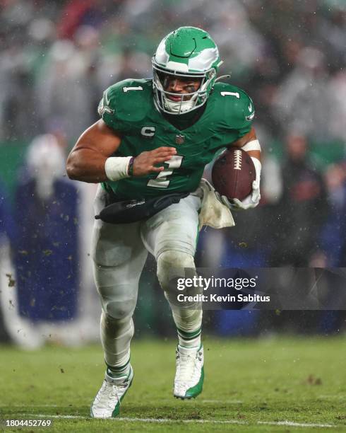 Jalen Hurts of the Philadelphia Eagles scores a game-winning touchdown during overtime of an NFL football game against the Buffalo Bills at Lincoln...