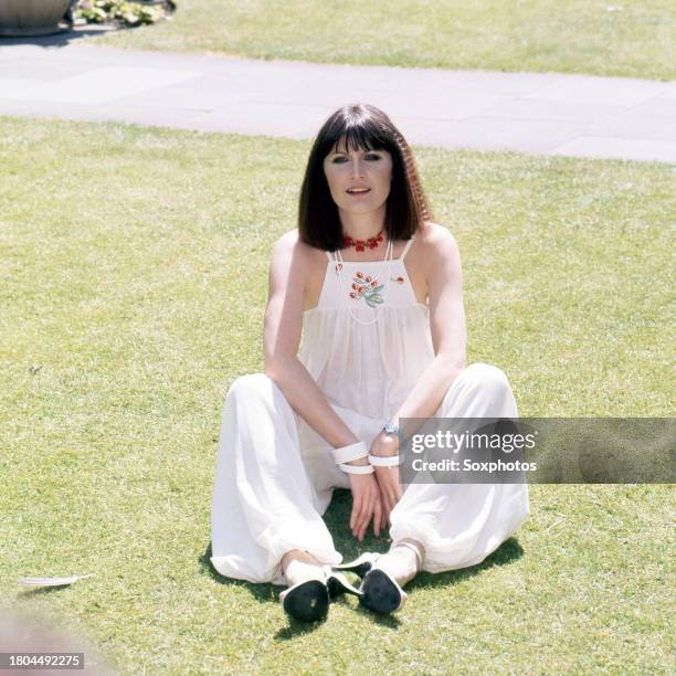 Photo of English Pop singer Sandie Shaw as she poses in a public park, London, England, June 1, 1977.