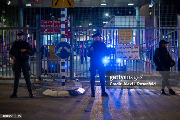 Border police officers stand guard outside The Kirya near where families of the hostages wait to enter a meeting with Prime Minister Benjamin...