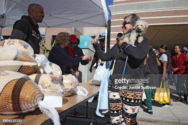 People line up to receive a free turkey during the 3rd annual Los Angeles Police Department turkey drive at Wilshire Station on November 20, 2023 in...