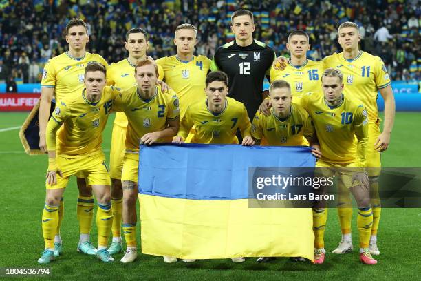Players of Ukraine pose for a team photograph prior to the UEFA EURO 2024 European qualifier match between Ukraine and Italy at BayArena on November...