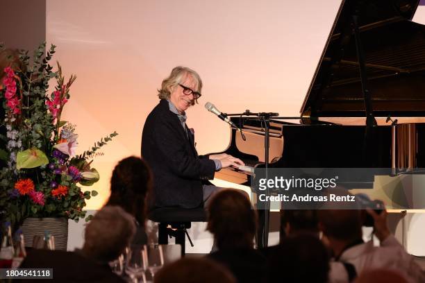 Helge Schneider plays the grand piano after he received the Art Prize of The State Of North Rhine-Westphalia at K21 Kunstsammlung Nordrhein-Westfalen...