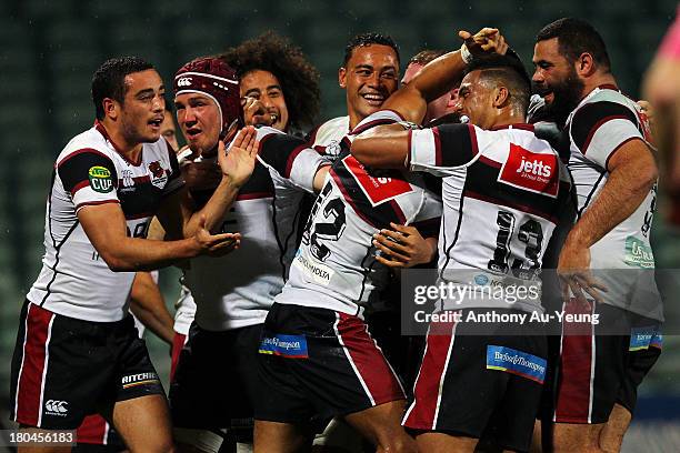 Francis Saili of North Harbour is mobbed by teammates after scoring a try during the round five ITM Cup match between North Harbour and Tasman at...