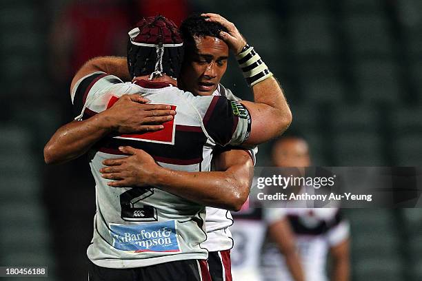 James Parsons of North Harbour shares a hug with teammate Irwin Finau after the round five ITM Cup match between North Harbour and Tasman at North...