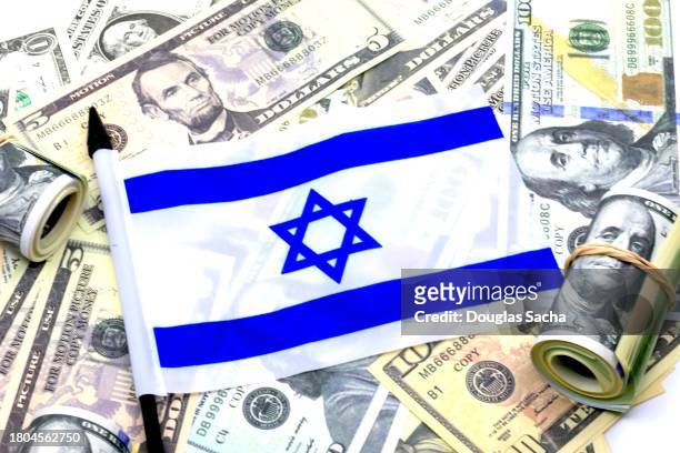 israel flag supported by usa cash and debt - dollar stock pictures, royalty-free photos & images