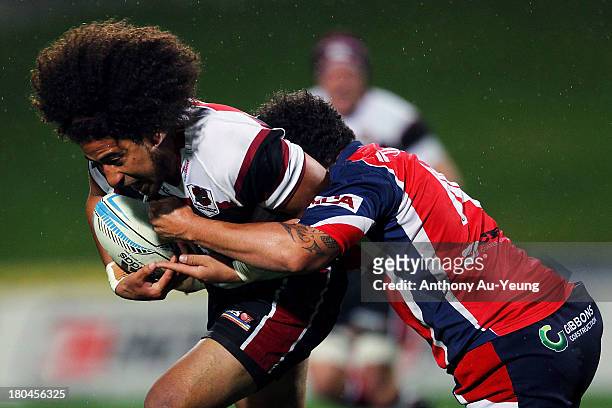 Tua Saseve of North Harbour is tackled by Robbie Malneek of Tasman during the round five ITM Cup match between North Harbour and Tasman at North...