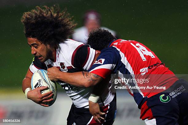 Tua Saseve of North Harbour is tackled by Robbie Malneek of Tasman during the round five ITM Cup match between North Harbour and Tasman at North...